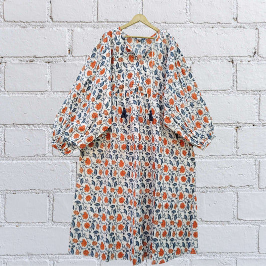 “Front view of white-orange floral handblock boho midi dress with puff sleeves”